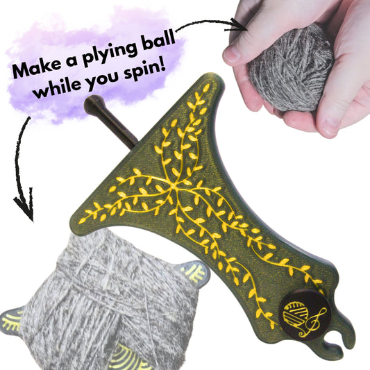 a hand holding a ball of spun single yarn to ply from alongside a sparkly green with gold leaves design mayan spin and ply spinners with the caption make a plying ball while you spin