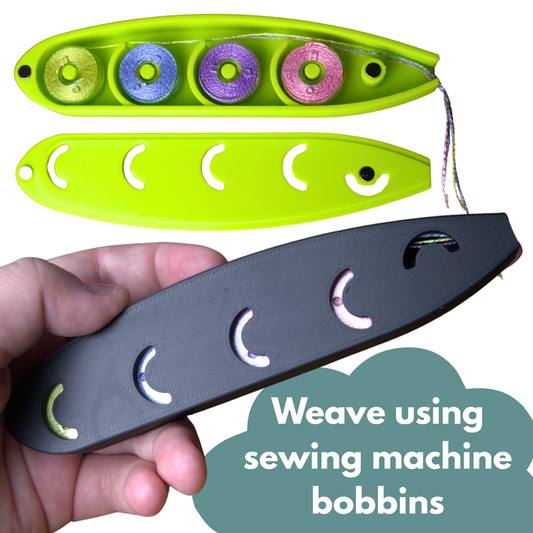 a hand holding a black thin fish-shaped shuttle containing four sewing machine bobbins. Above is the same shuttle but in Lime green and opened up to show four bobbins full of thread with the ends spilling out of its mouth for use in weaving. Also shown are small magnets for closure.