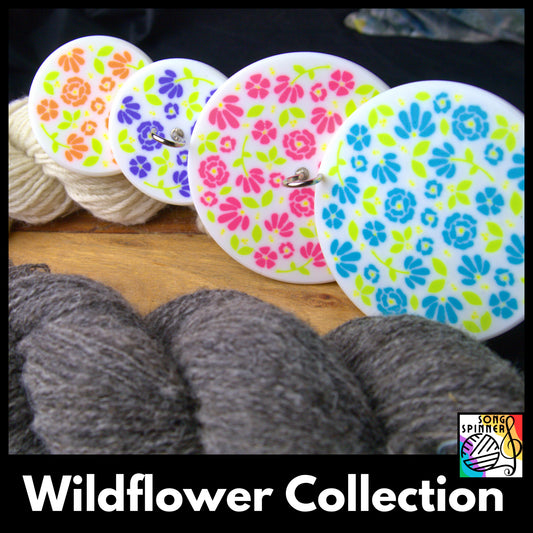 an array of colourful floral drop spindles alongside some grey and white handspun wool. Text reads 'wildflower collection' with the song spinner logo