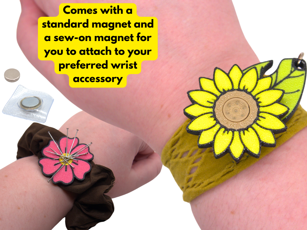 Flower-shaped wrist pincushions  with magnets on a person's wrist.