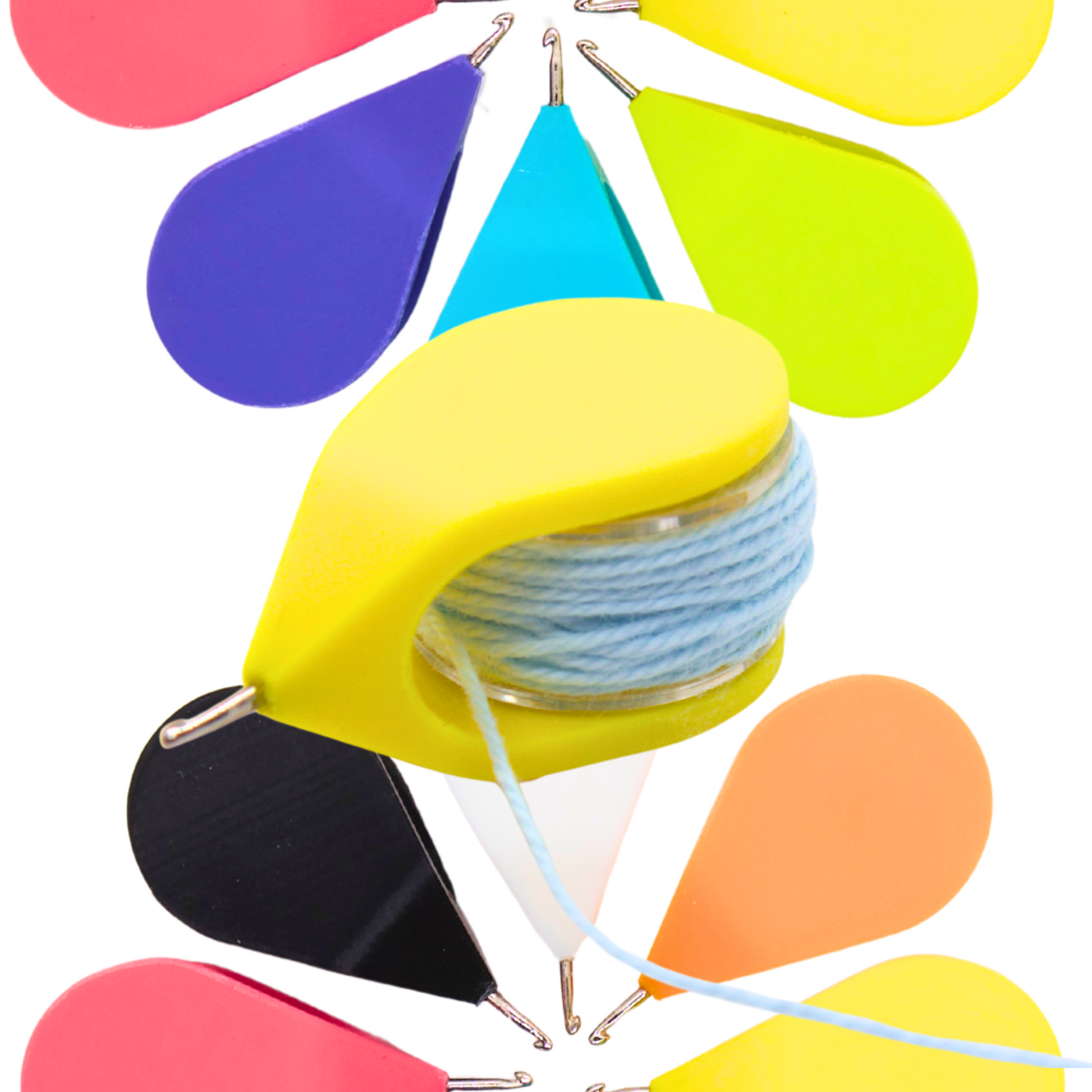 yellow teardrop hook tatting shuttle with a sewing machine bobbin in it