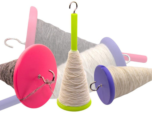 Colorful drop spindles on a white background