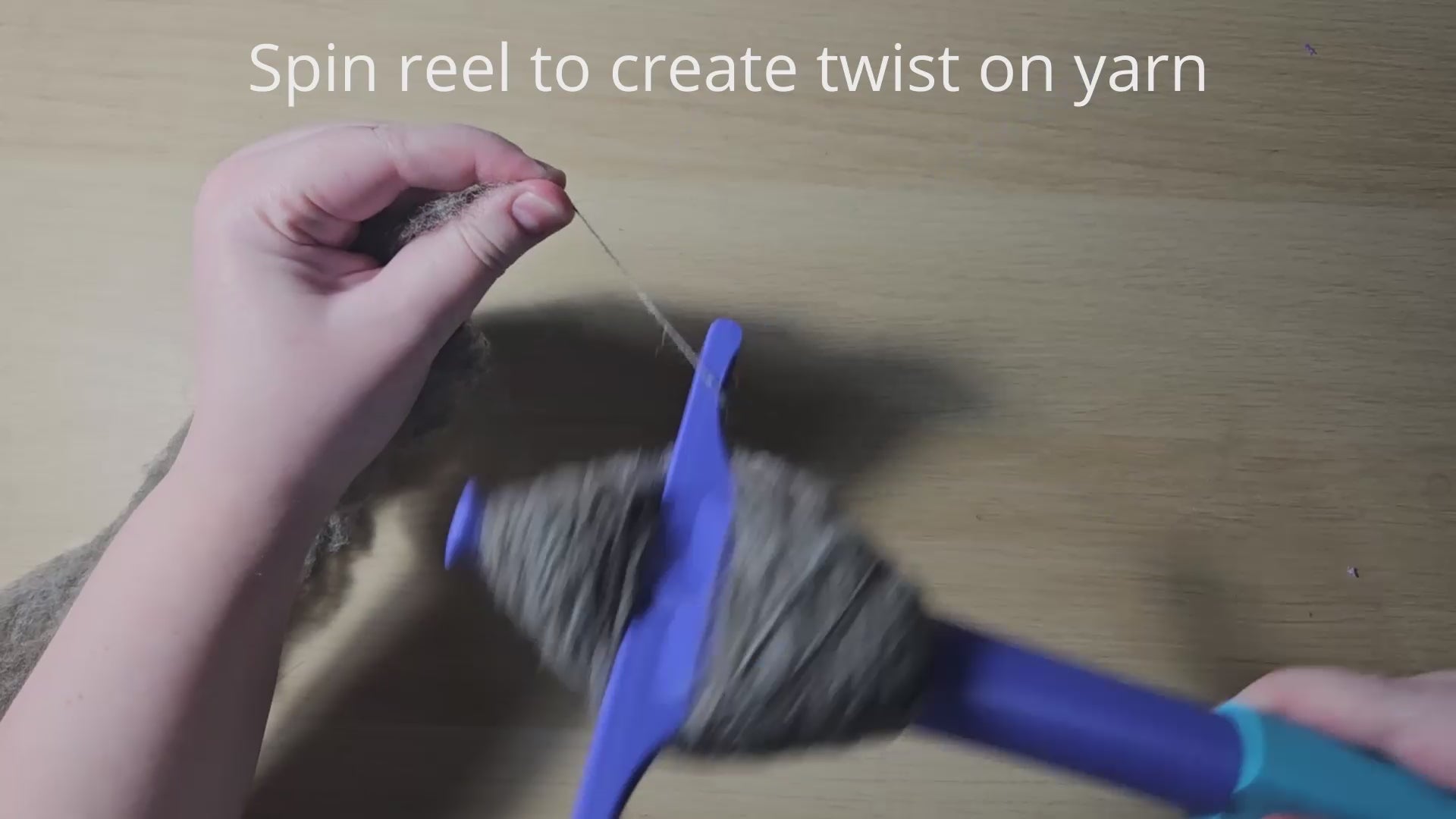 a video demonstrating how to use the plying druga. Text reads 'create spin on yarn' while my hands are rotating the reel, then 'draft yarn' (also suitable for one-handed draw) while showing me doing the park and draft method of spinning, allowing the twist I just created to travel down my fiber supply. Then the instruction 'wrap yarn around peg' (guide in listing pictures) shows me wrapping the now spun single onto the tool in the correct way in order to achieve a plying ball. Plying ball removal follows